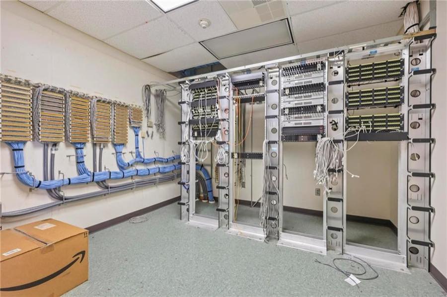 Network room with racks and patch panels