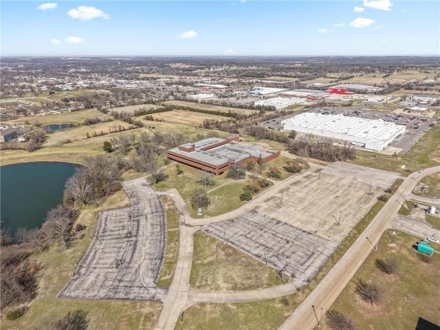 Drone overview: building, parking lots and pond